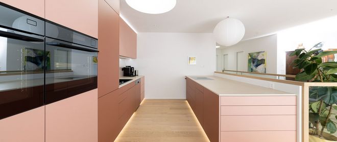 Modern interior design with calm oak parquet flooring and customised furniture Interior finishing materials from Roser AG