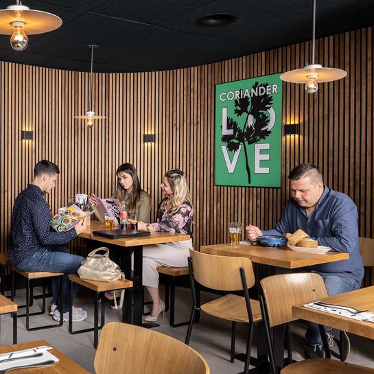 Acoustic wall panelling for restaurant in antique rustic oak