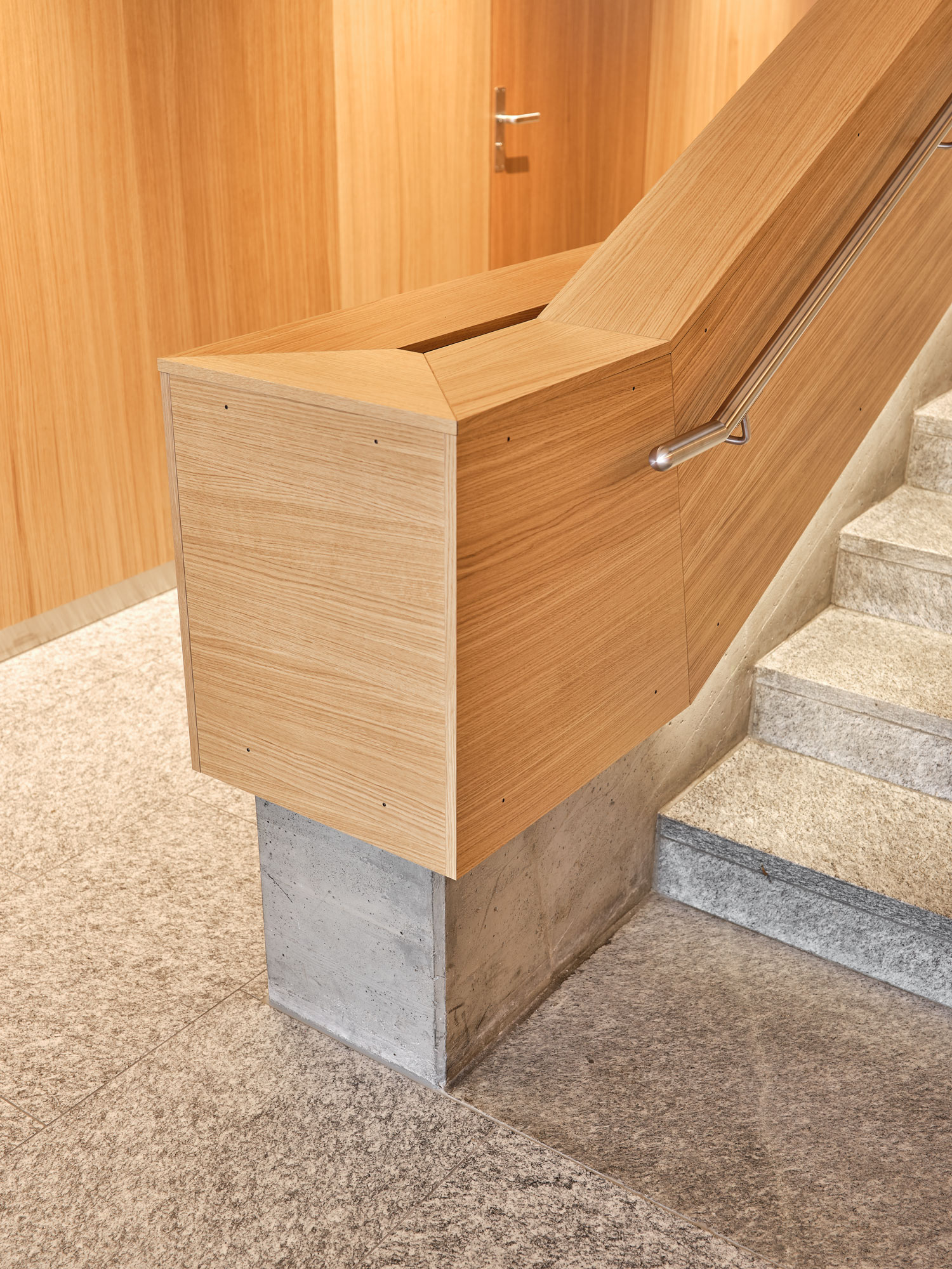 Solid oak veneer, Muri Community Centre Stair railings and fire doors with oak veneer in the refurbished Muri community centre